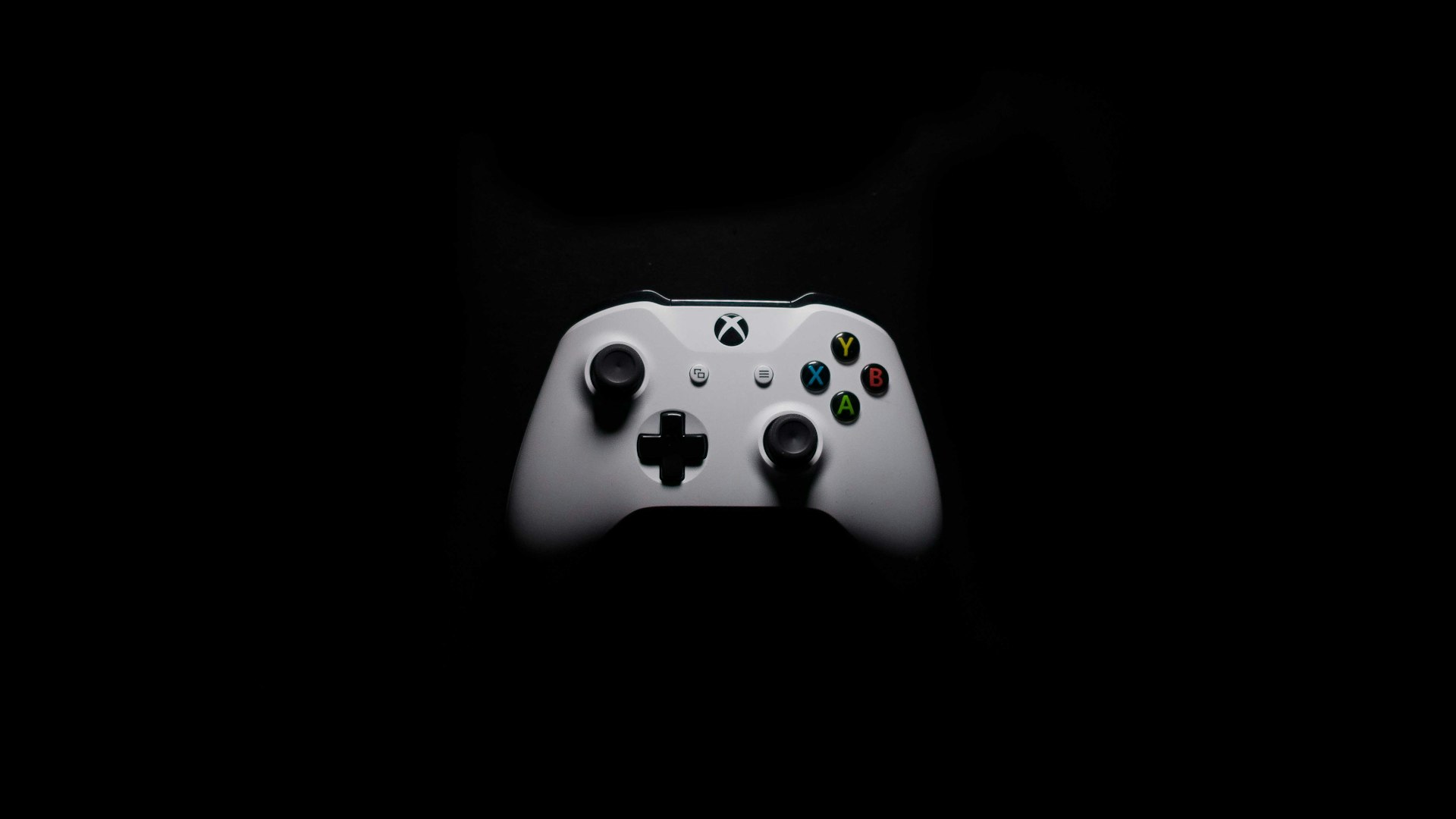 Neon-lit arcade cabinets glowing in a dim room